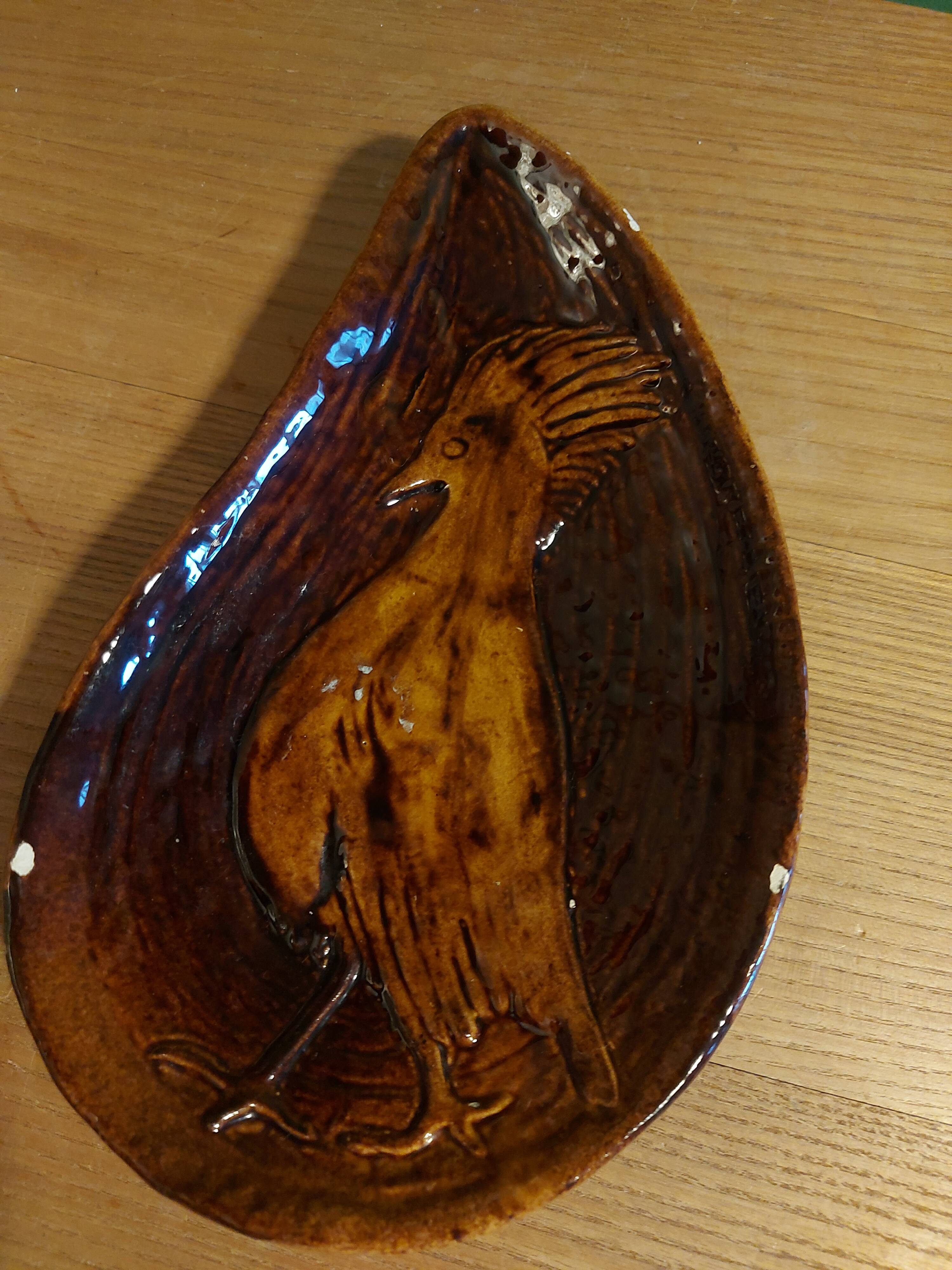 Empty pocket with vallauris bird decoration