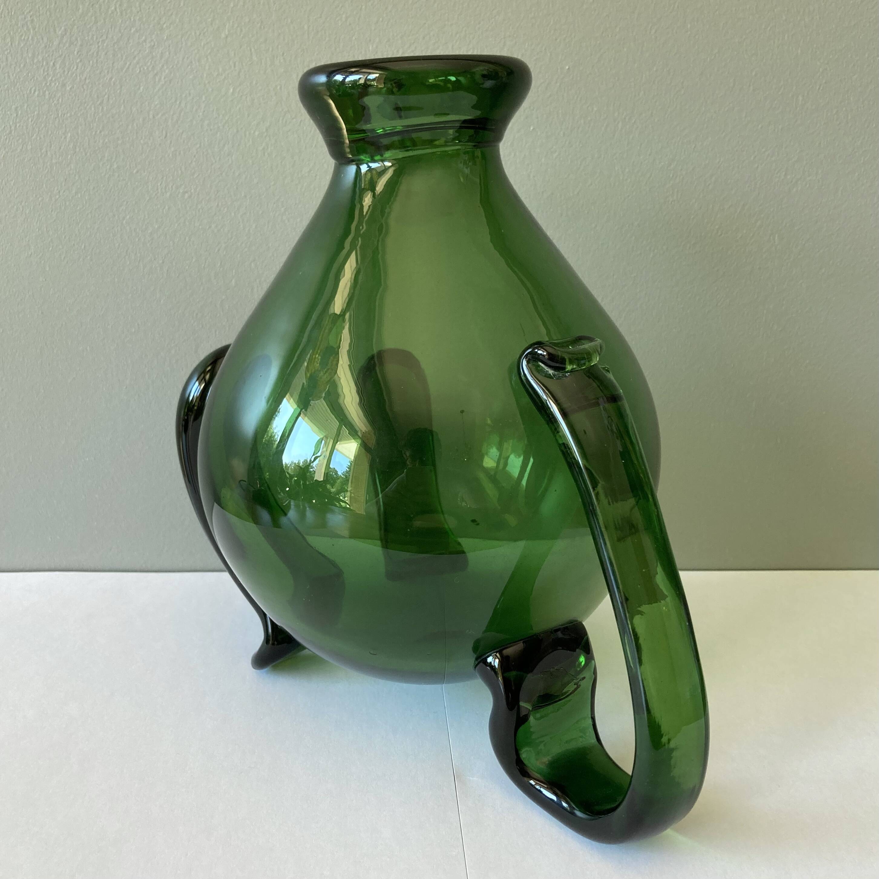 Amazing pitcher; vintage tripod jug or carafe in blown and hot-worked green glass