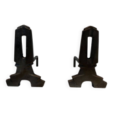 Pair of Modernist Andirons in Cast Iron with Openwork Uprights and Tripod Bases