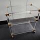 Dessert in plexiglass and brass.