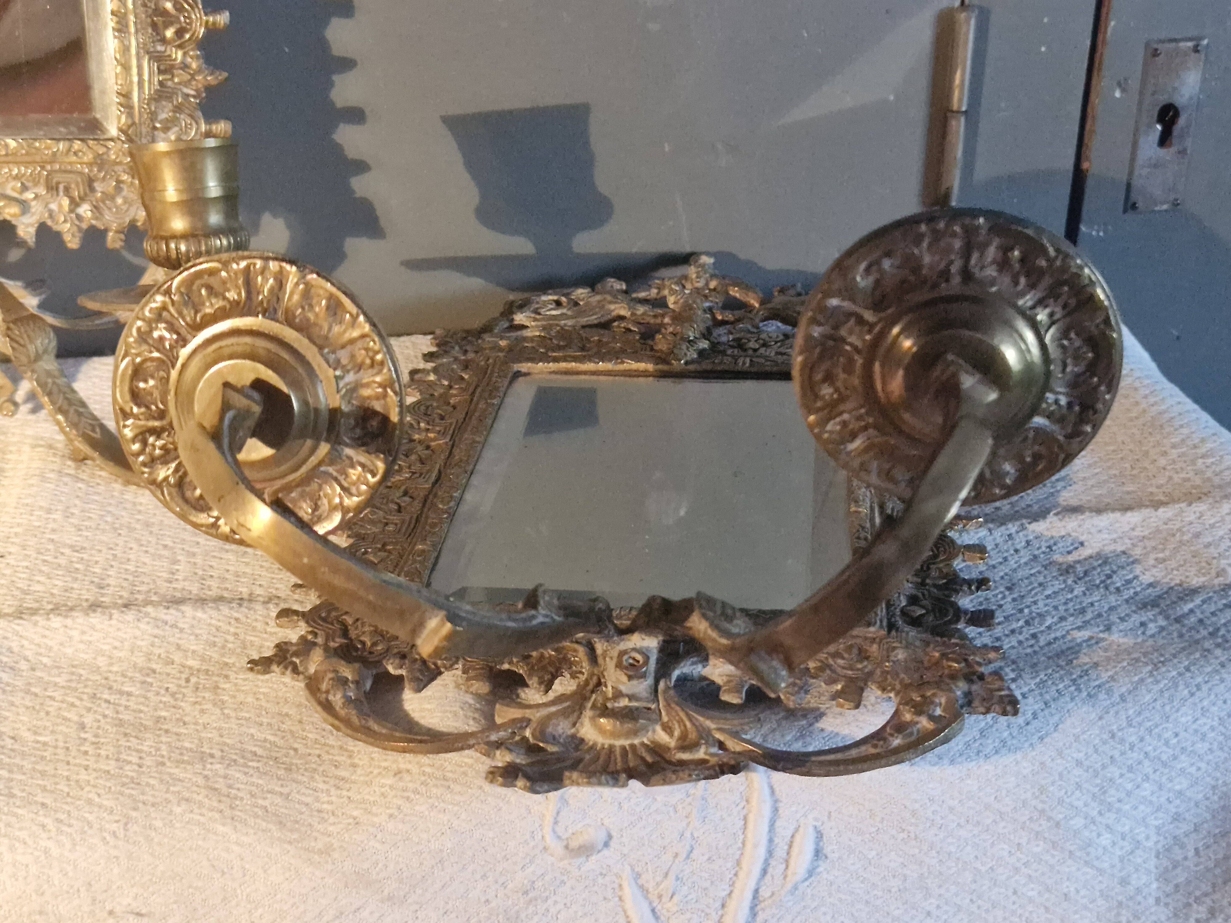 Pair of mirror sconces/candle holders in 19th-century bronze.