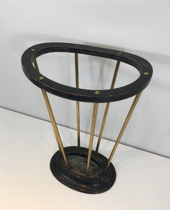 Umbrella stand in blackened wood and brass. Attributed to Jacques Adnet