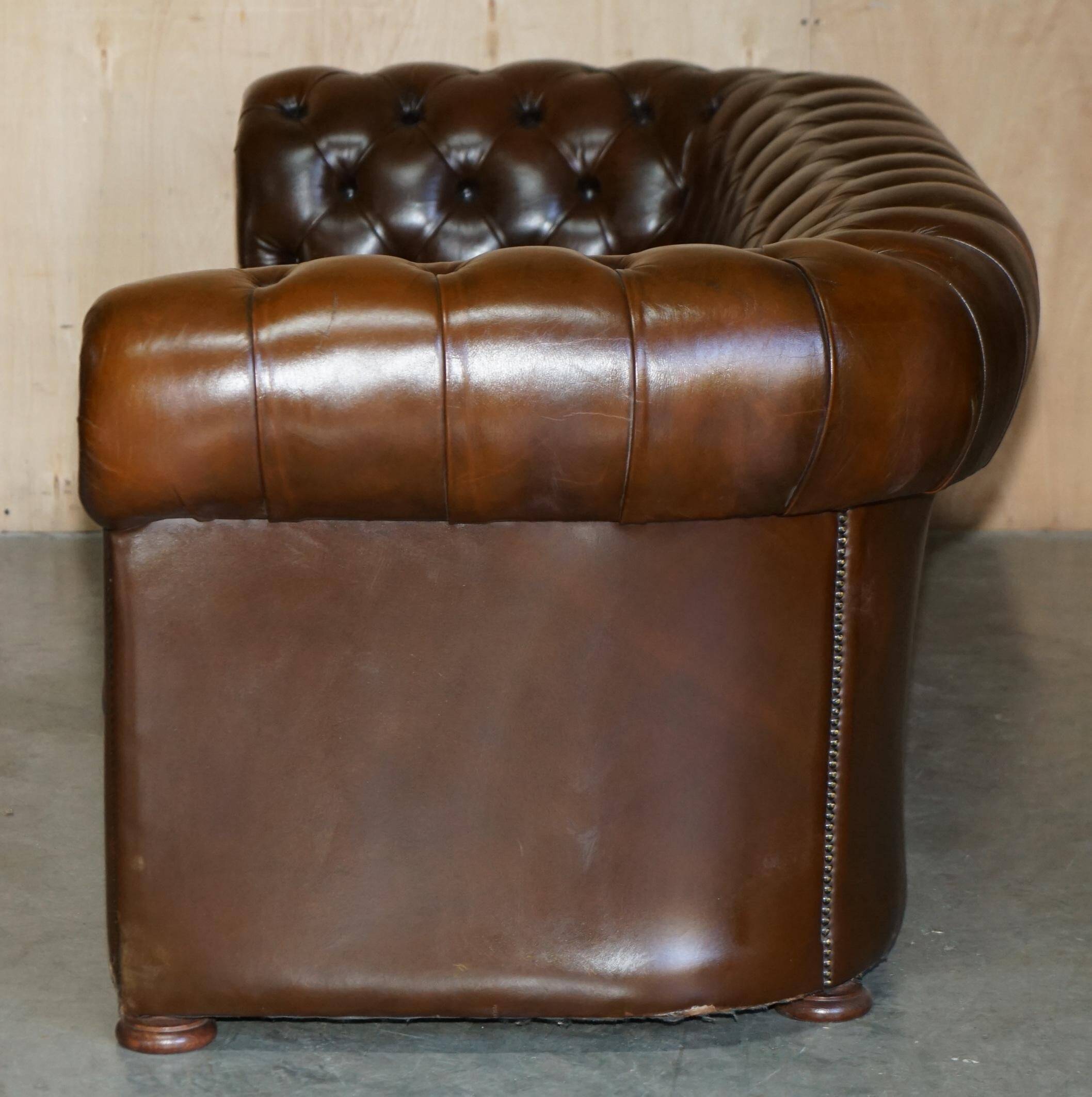 Restored Chesterfield leather sofa in vintage Art Deco style