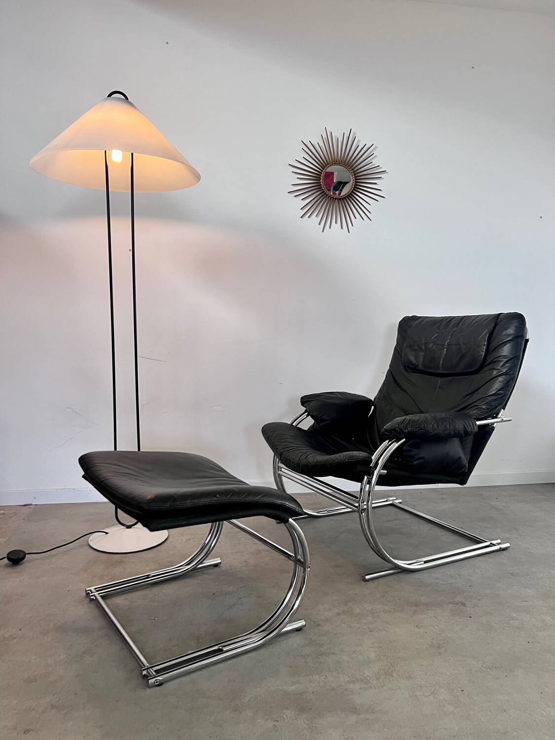 Old armchair and ottoman black leather tubular chrome bauhaus design from the 70s