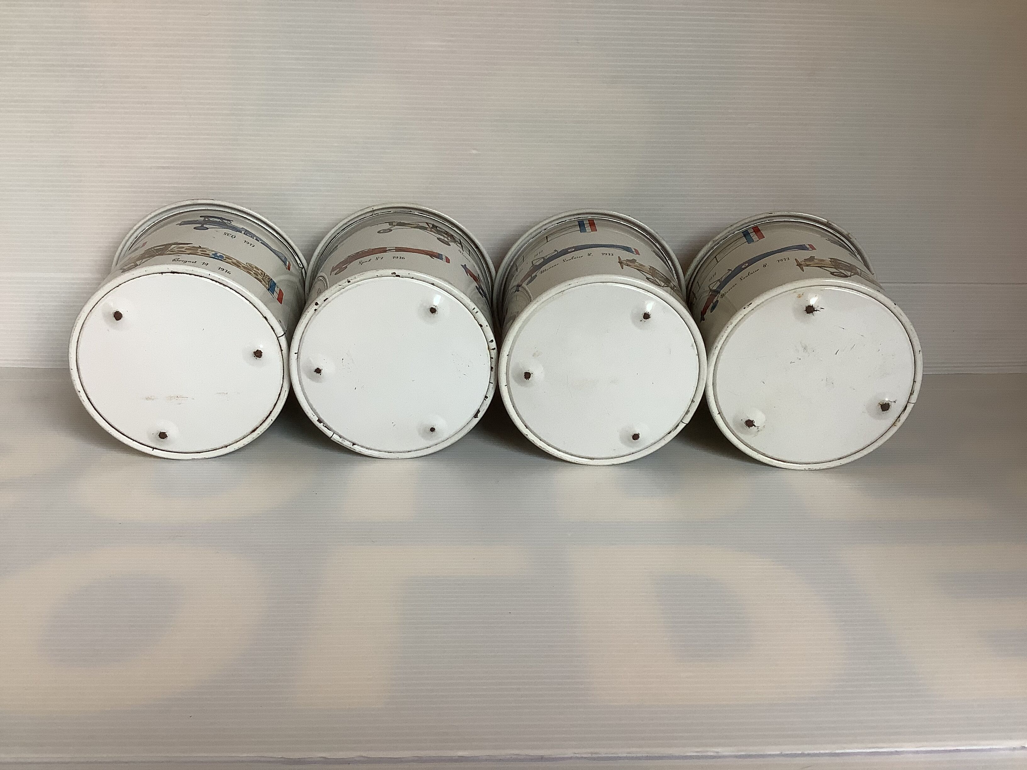 4 old metal boxes lithographed aircraft pattern