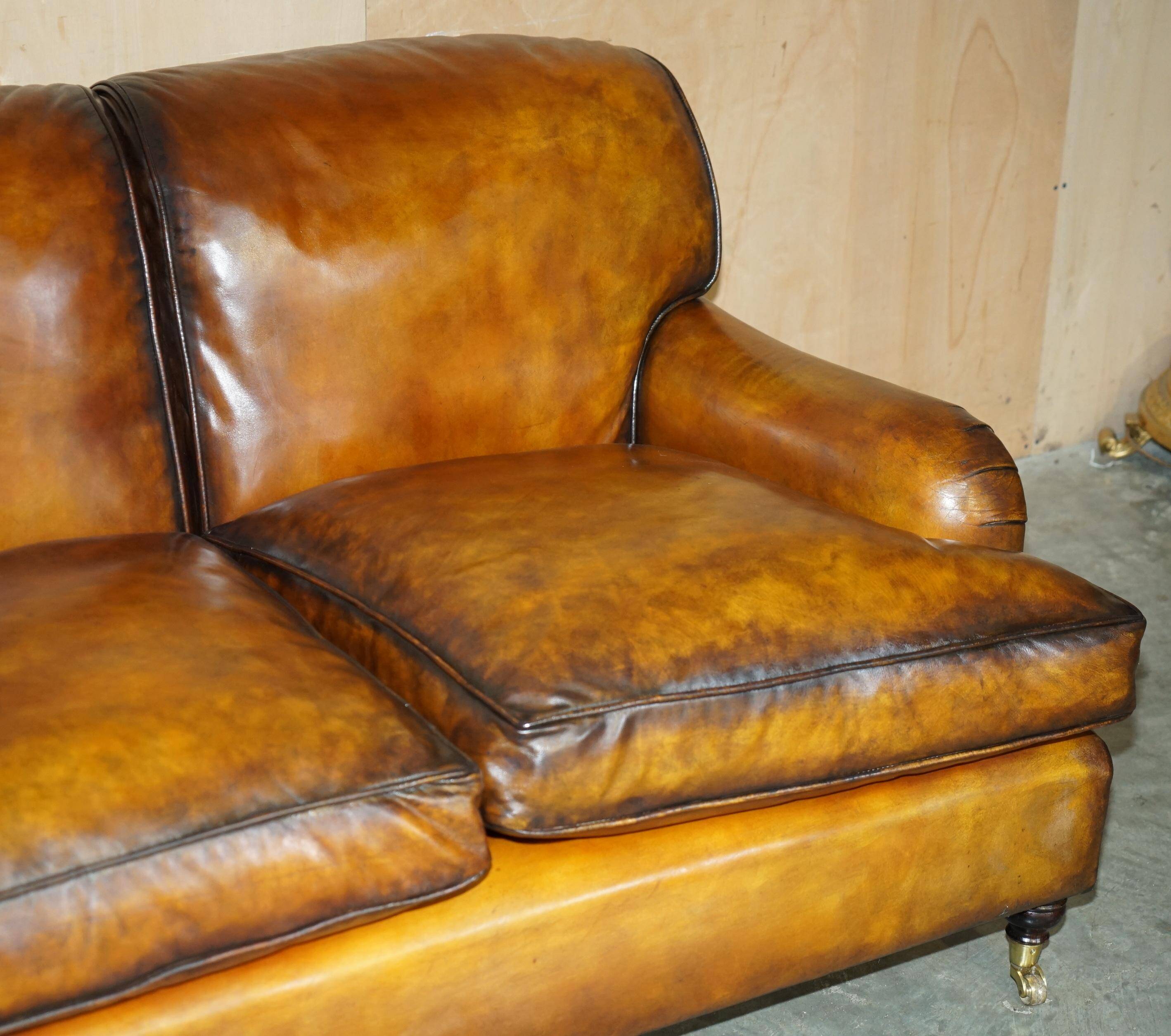 Howard & Son restored leather canapé, width 145 cm