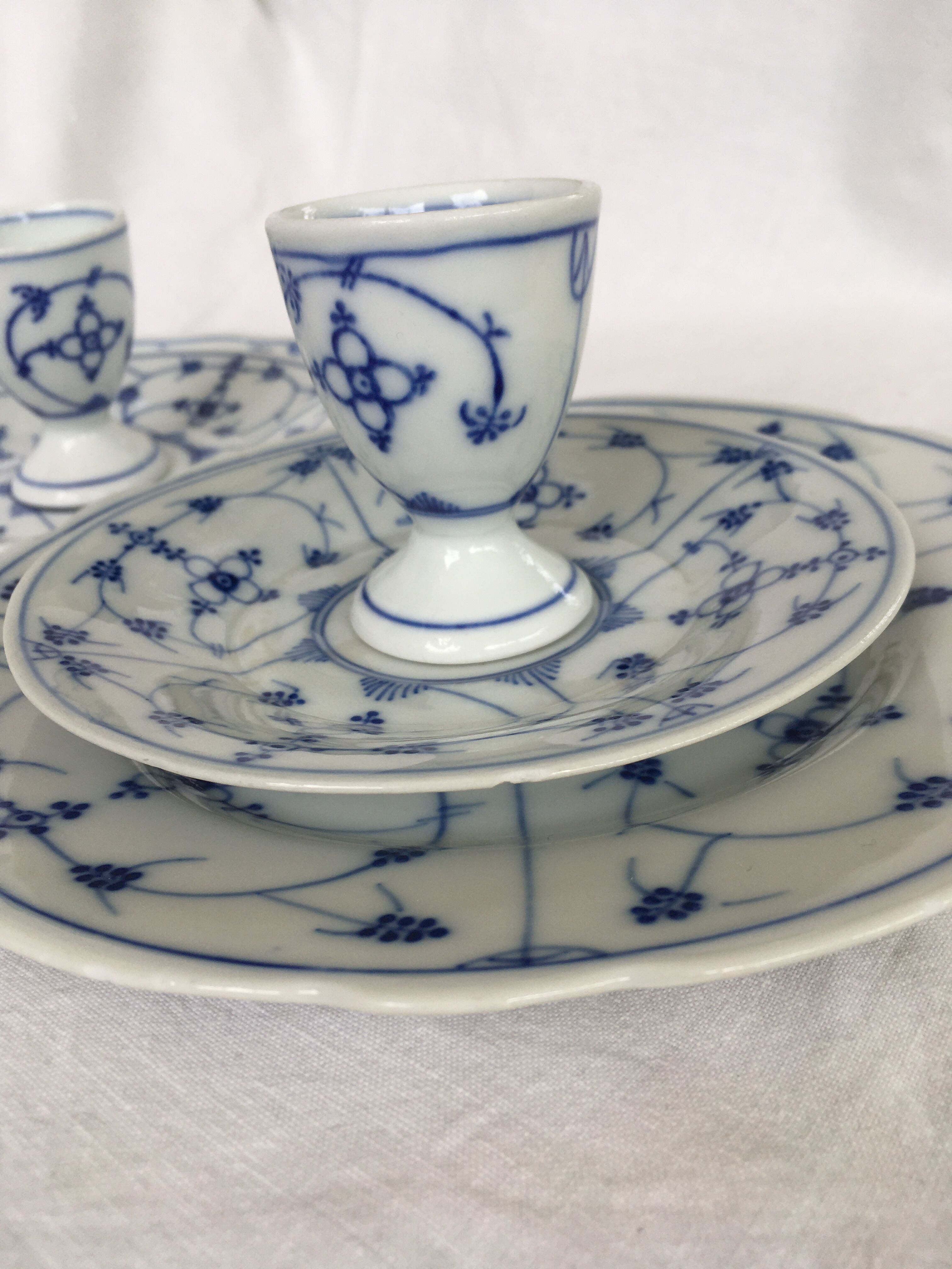 Breakfast coquetiers and porcelain plates