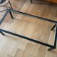 Smoked glass coffee table with chrome metal.