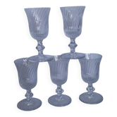 Ancient footed crystal glasses with relief twisted fluted goblets.