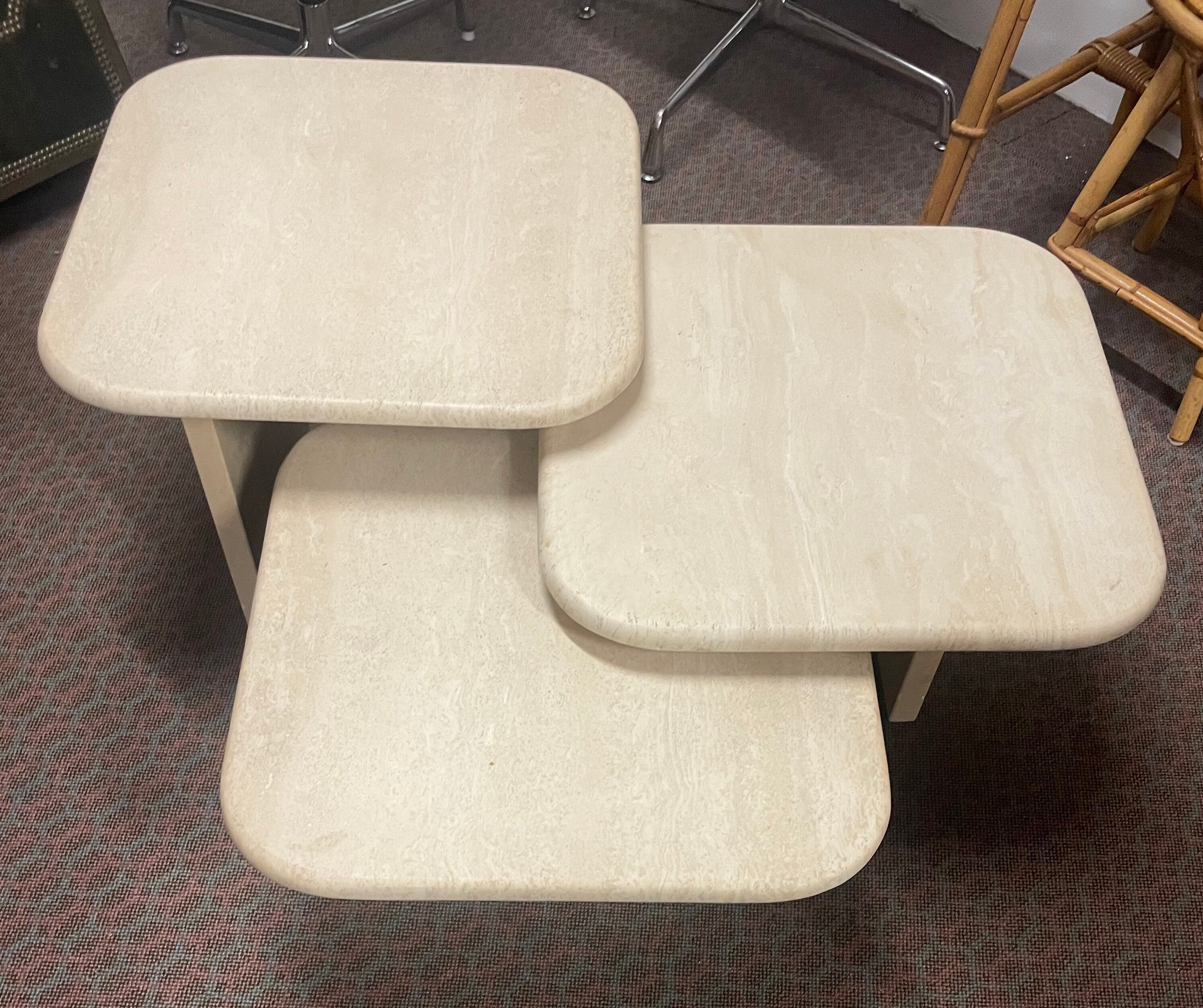 Modular pull-out coffee tables in travertine