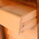 Cabinet with vinyl storage compartment