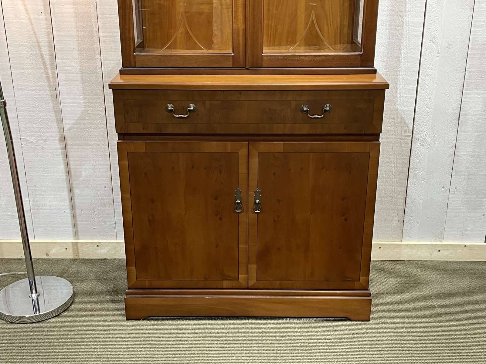 English display cabinet with two sections made of yew from the 1980s.