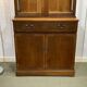 English display cabinet with two sections made of yew from the 1980s.