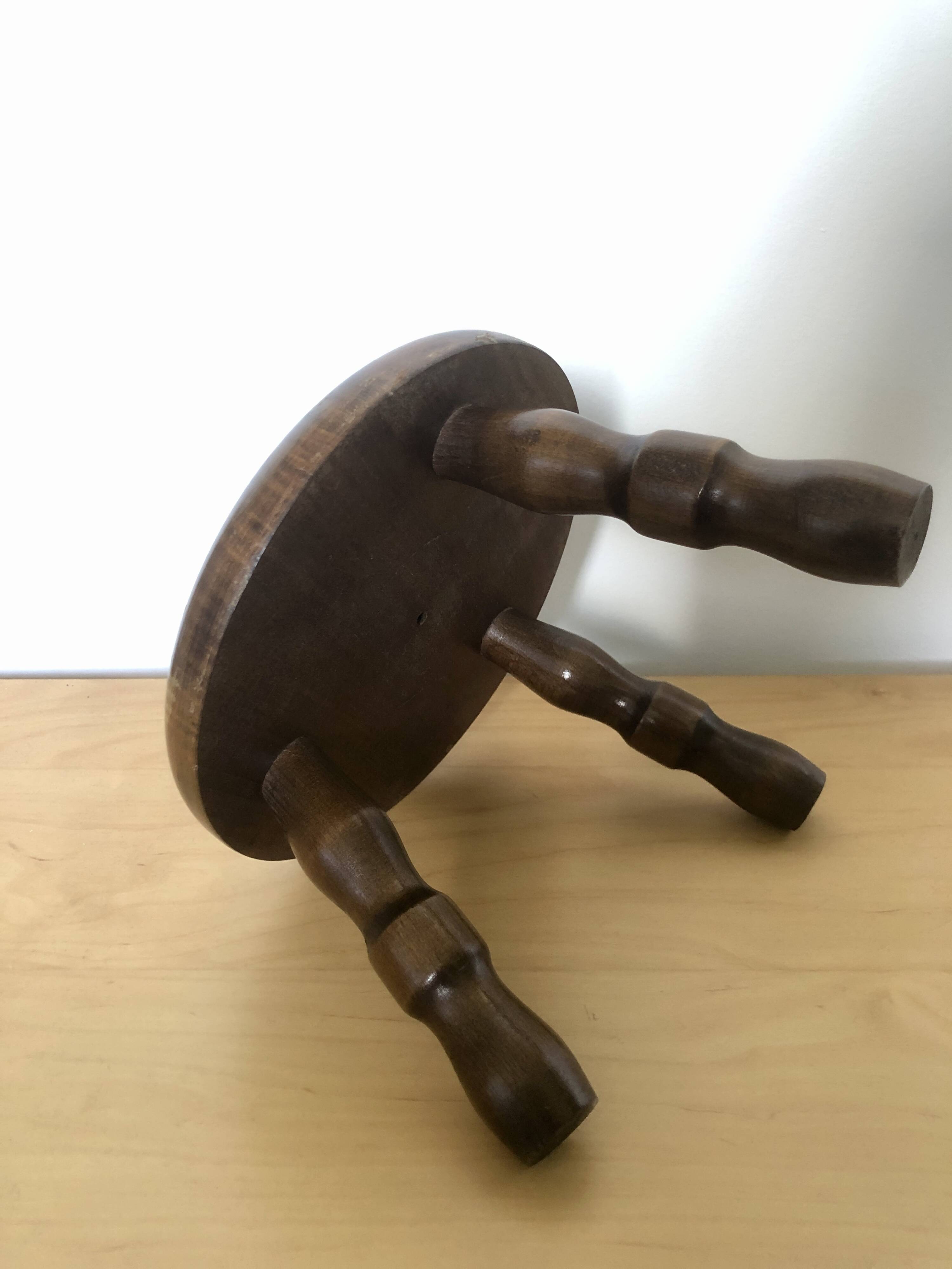 Low tripod stool in solid wood