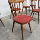 Huit chaises Baumann à assise colorée