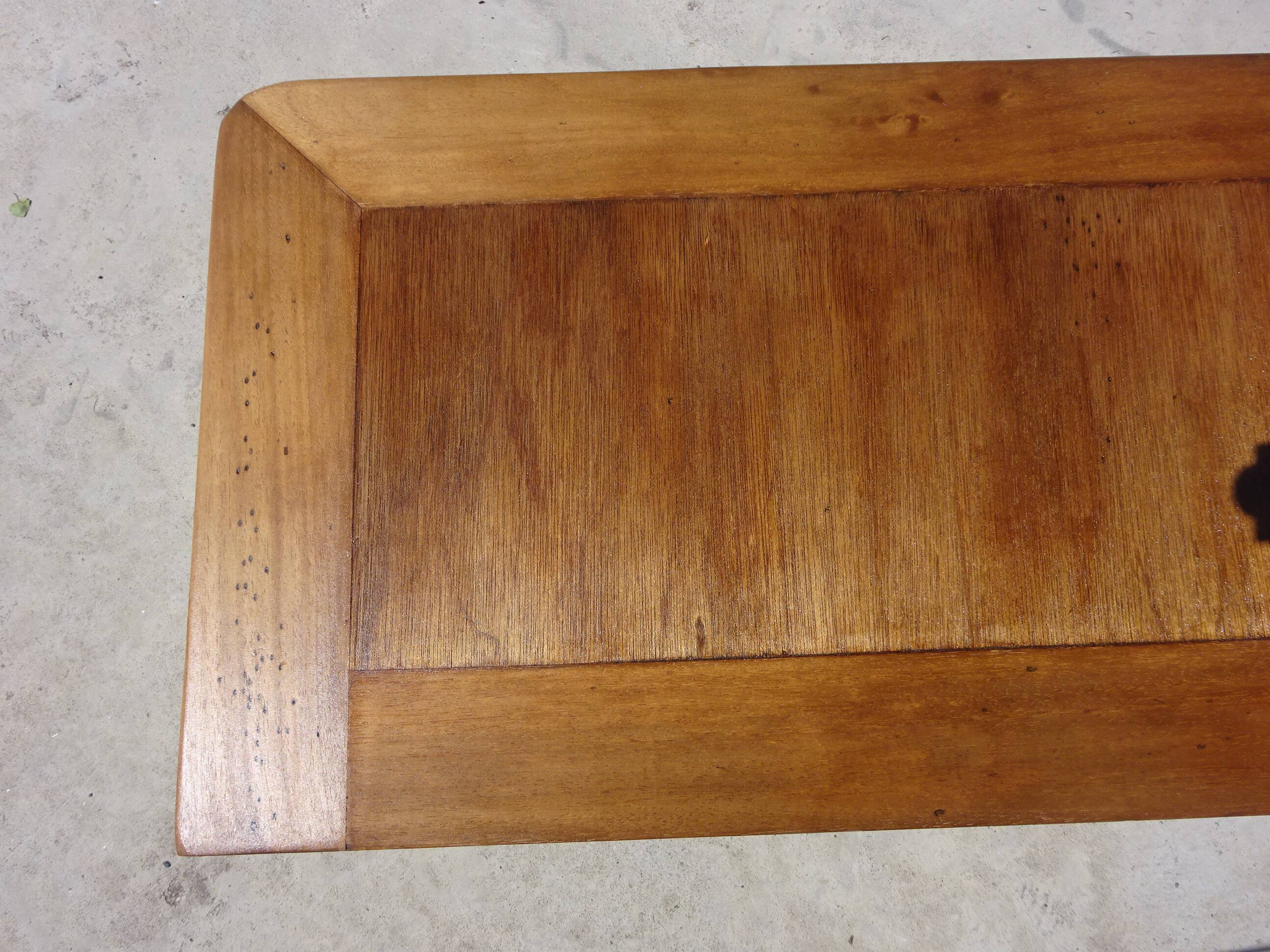 Chest of drawers with decorated handles in the Louis XVI style.