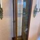 Walnut showcase, grooved uprights, 4 glass shelves