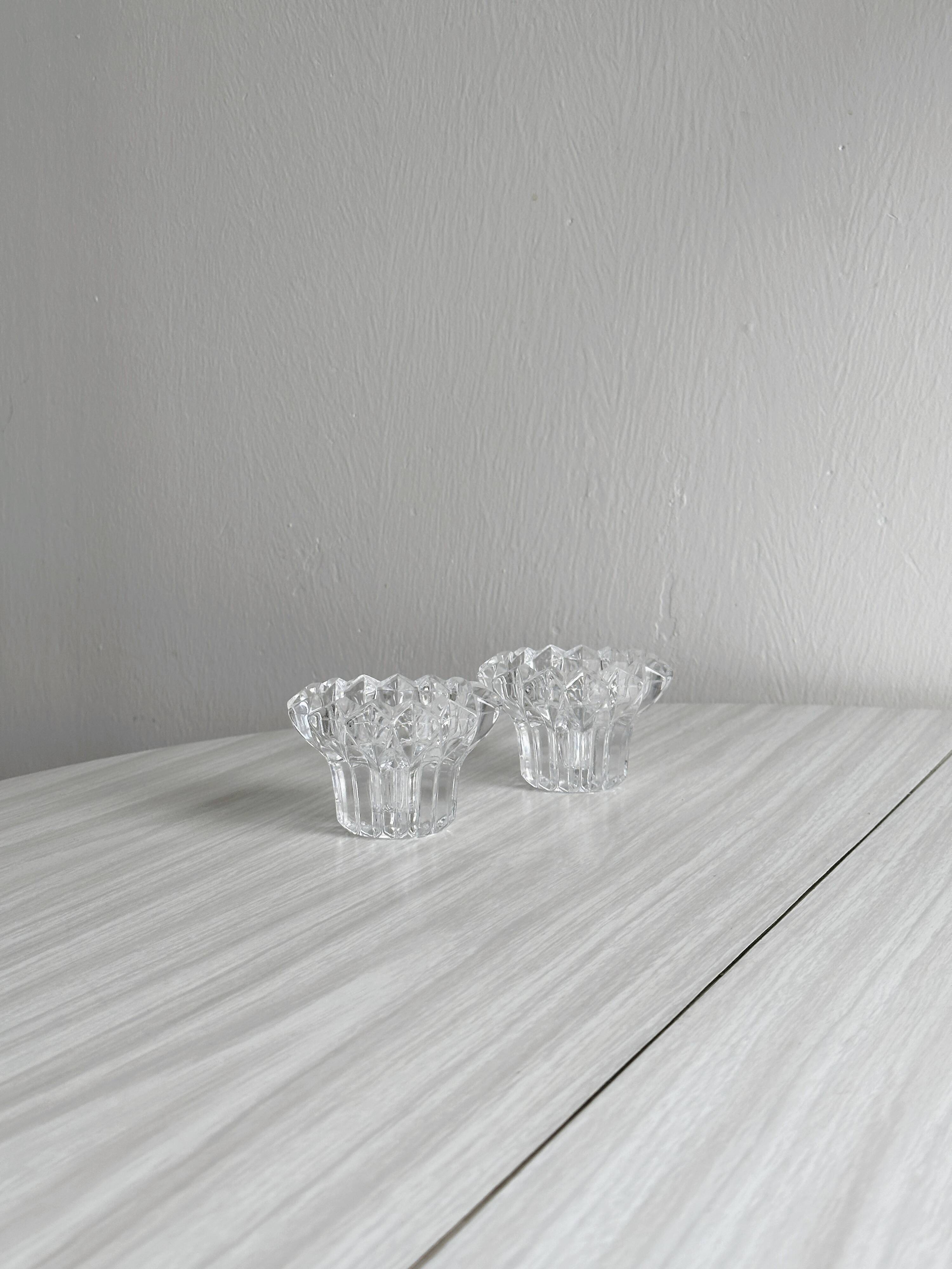 Elegant pair of faceted cut crystal candlesticks