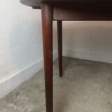 Scandinavian extendable round dining table in teak