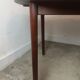 Scandinavian extendable round dining table in teak