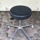 Stool on metal stand in star on wheels sitting round padded skaï bluish