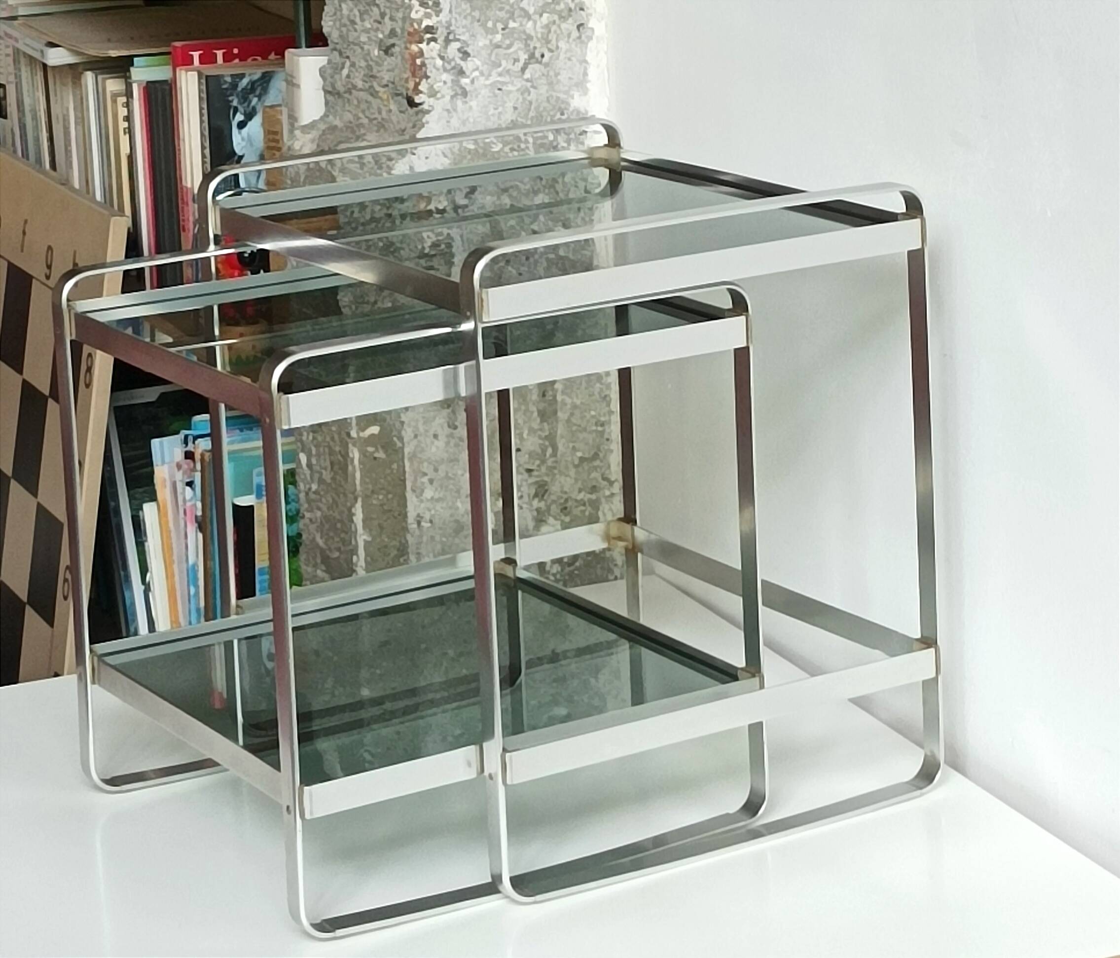 Nested tables in aluminium and smoked glass by Martini & Rossi, 1970s.