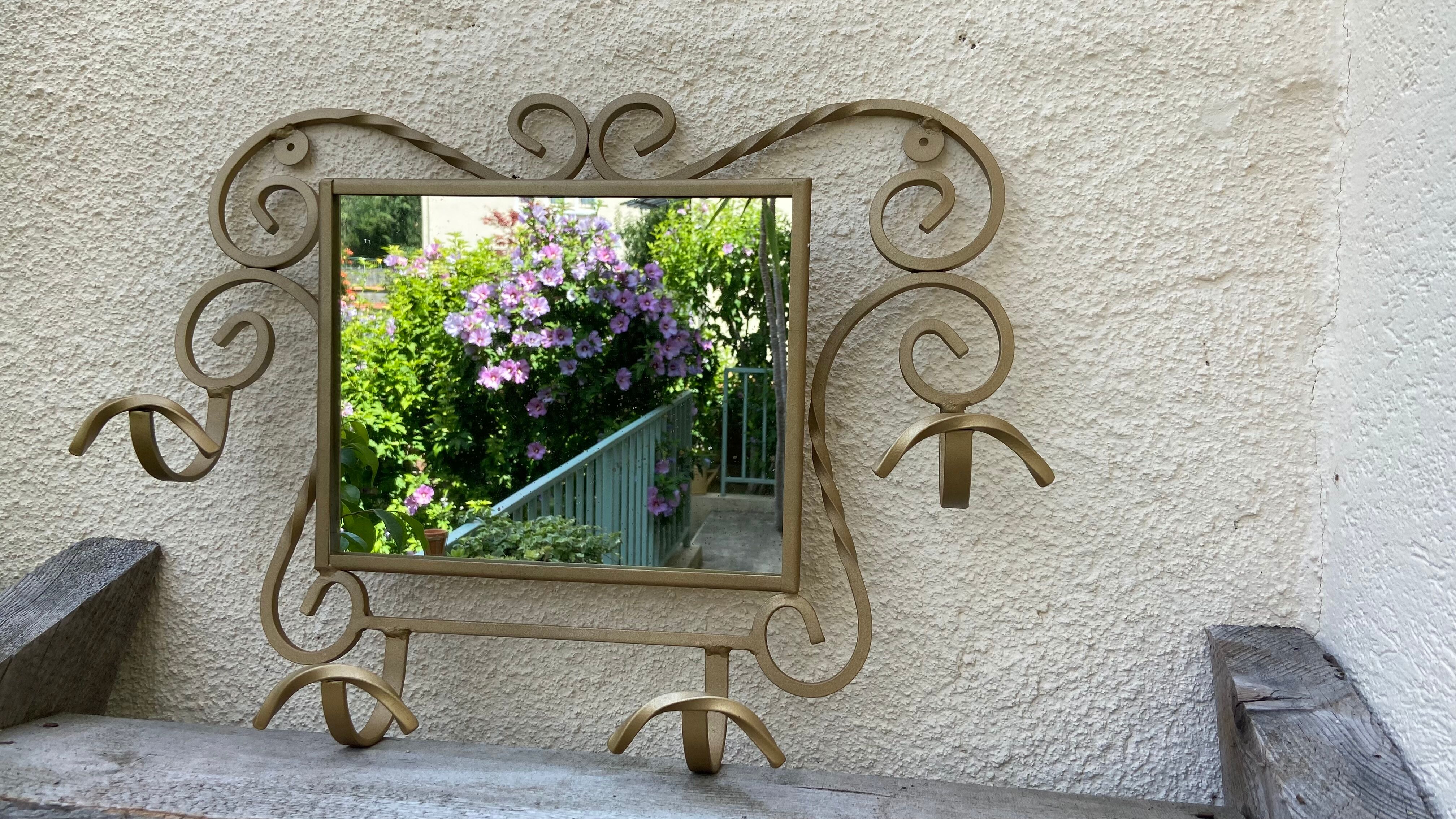 Wall-mounted gilded wrought iron coat rack with mirror