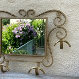 Wall-mounted gilded wrought iron coat rack with mirror