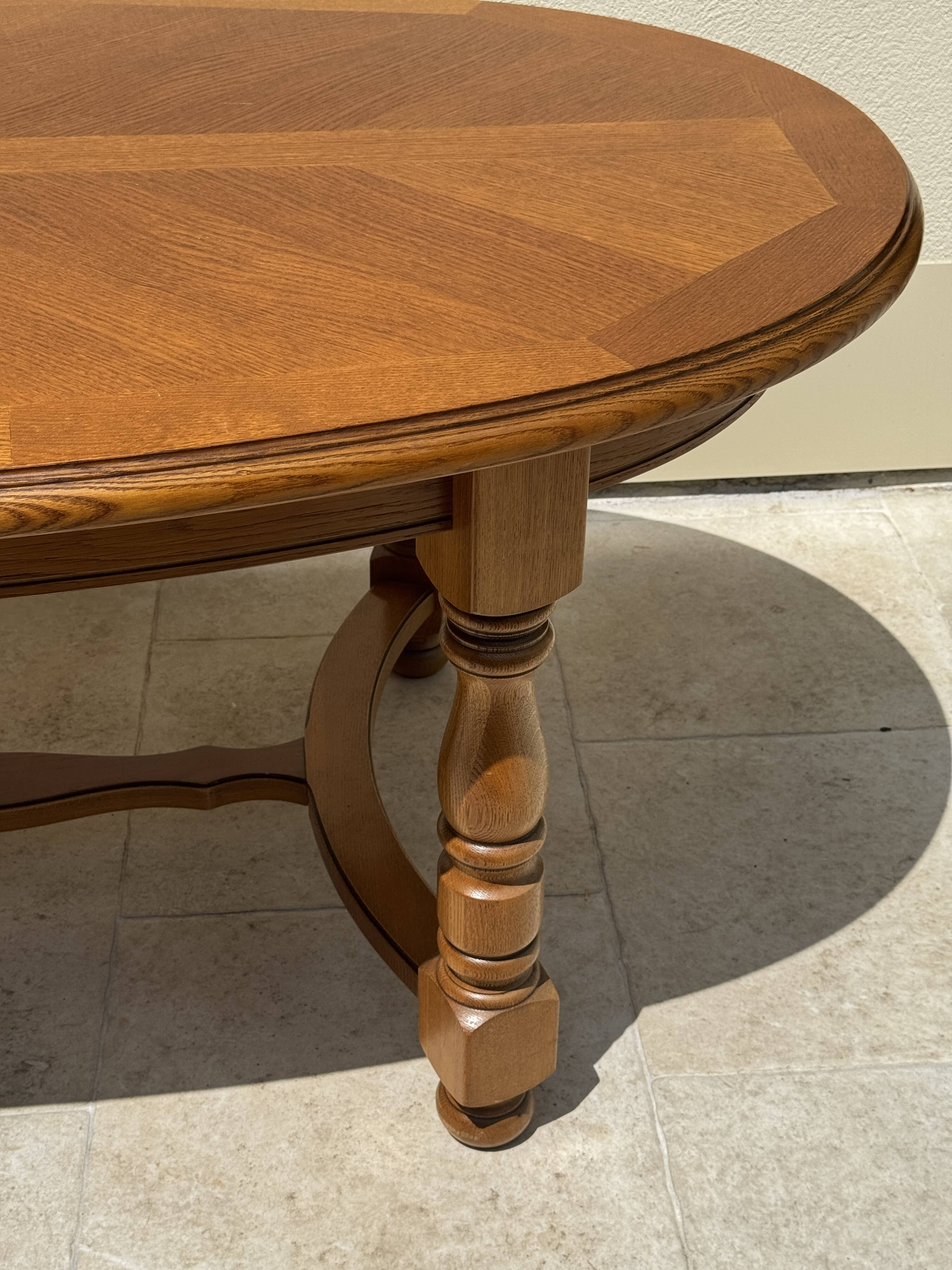 Oak dining table, oval living room table with two extensions.