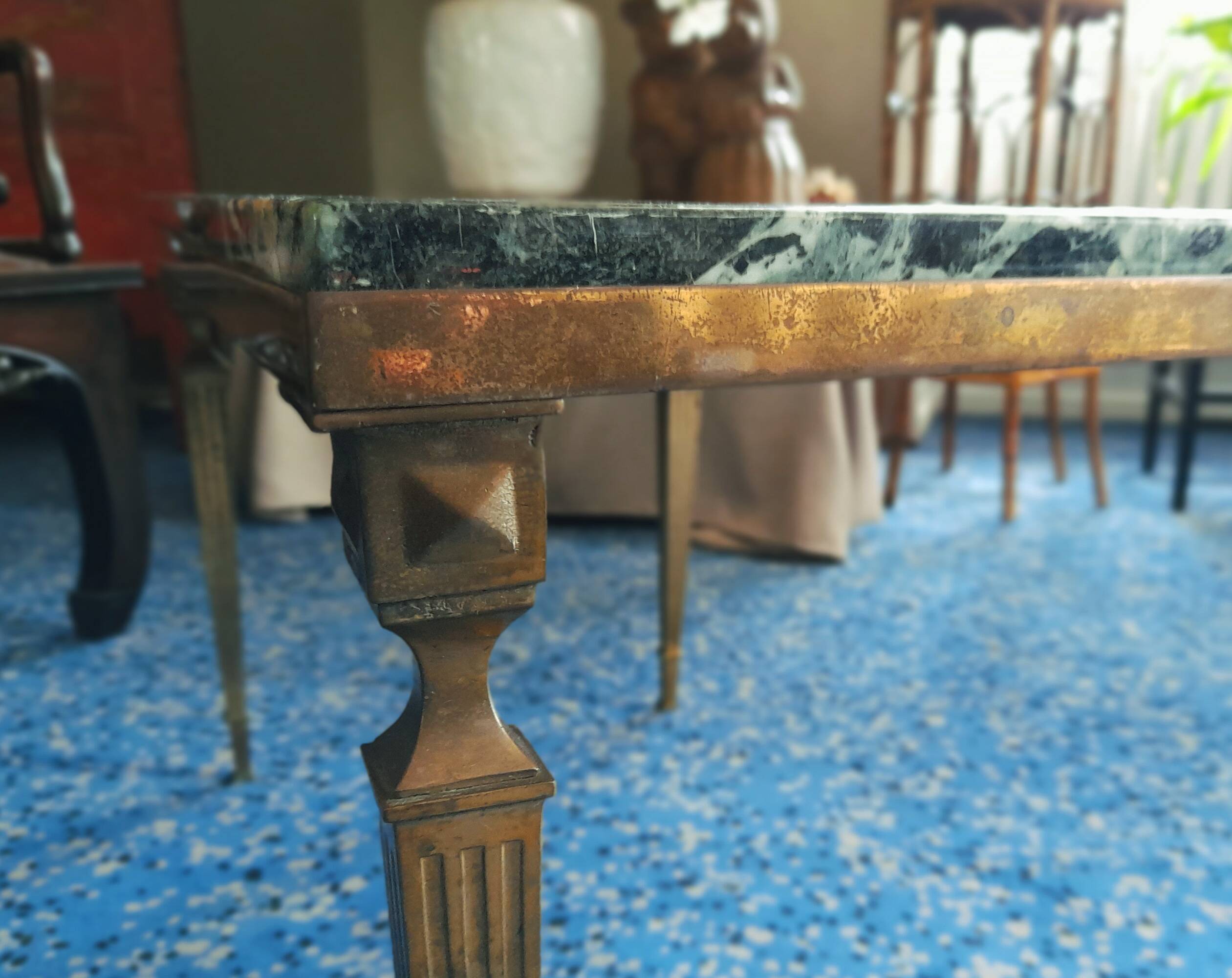 Coffee table in gilded bronze and green Alpine marble