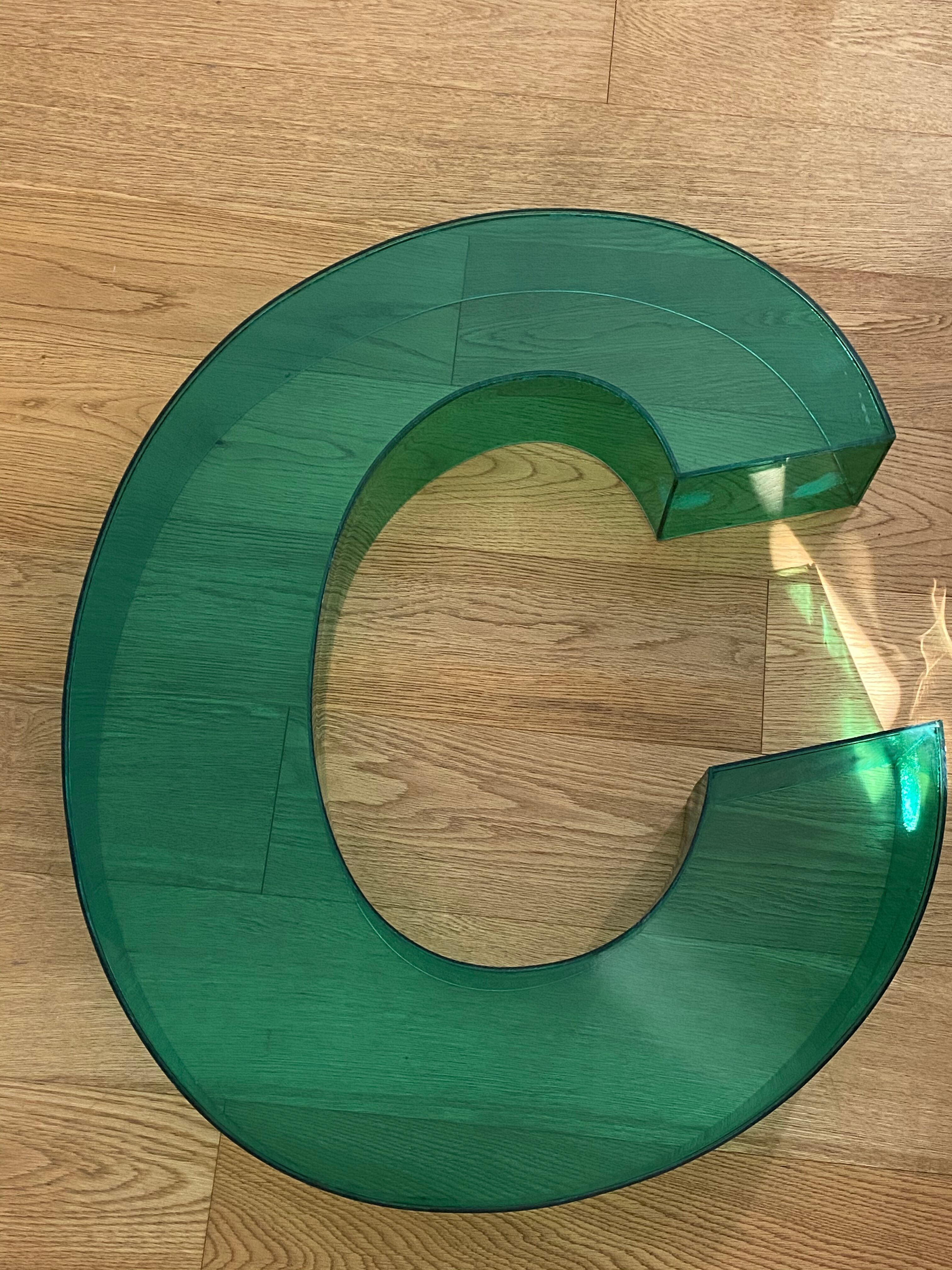 Letter signs C in transparent plexiglass