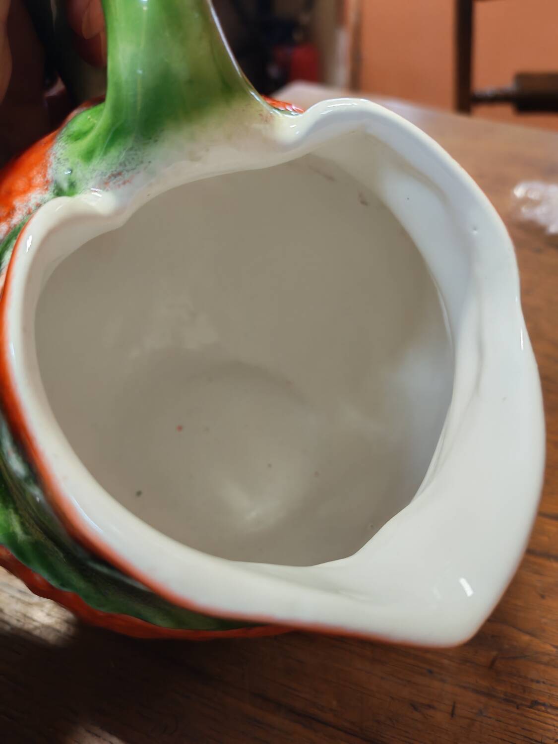 Orange slipware pitcher