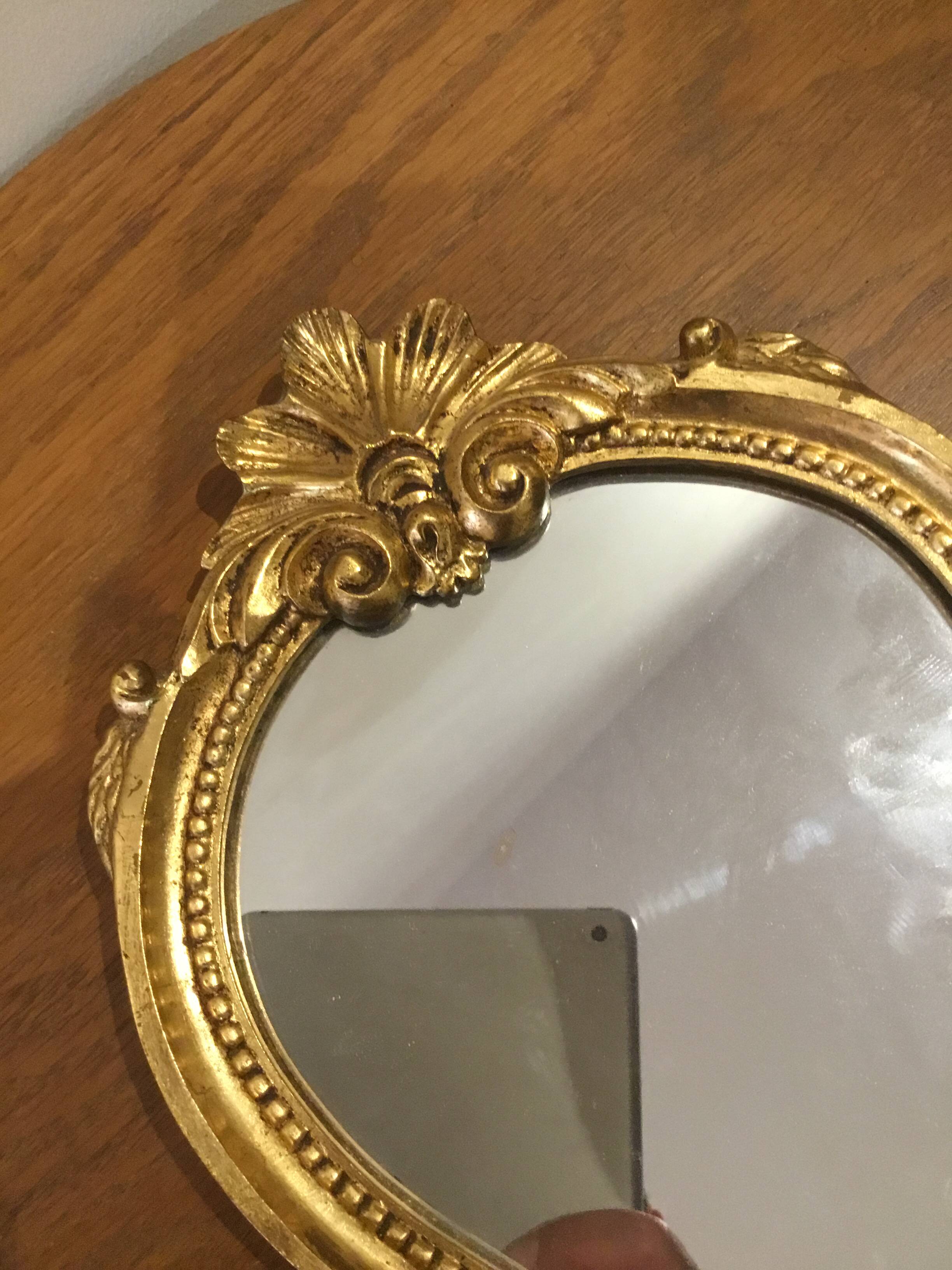 Golden wooden mirror in baroque style