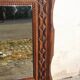 Tramp Art mirror from the 19th century in hand-carved wood.
