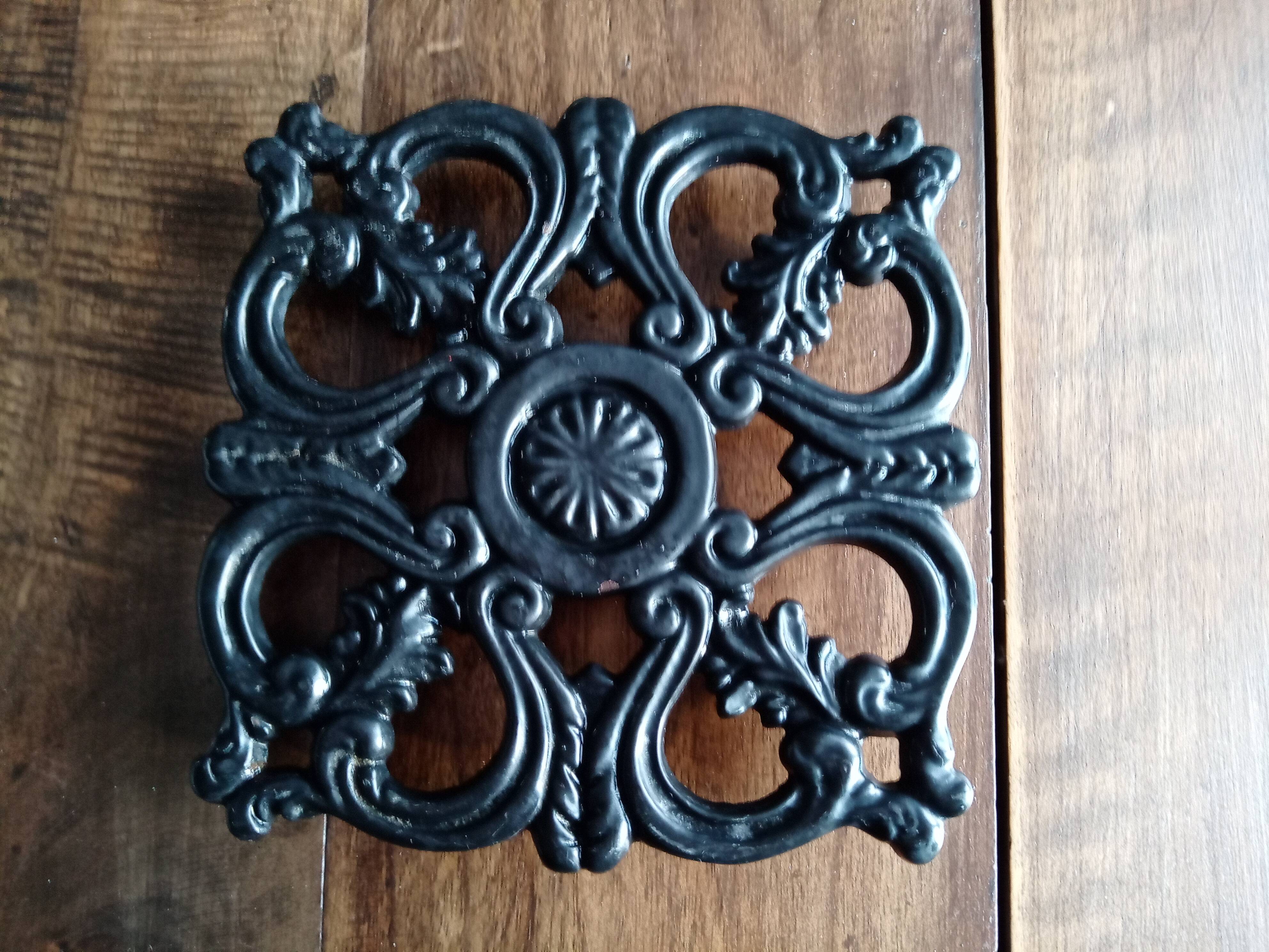 Old dish bottoms in black cast iron