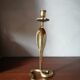 Candlestick mounted on brass cobra