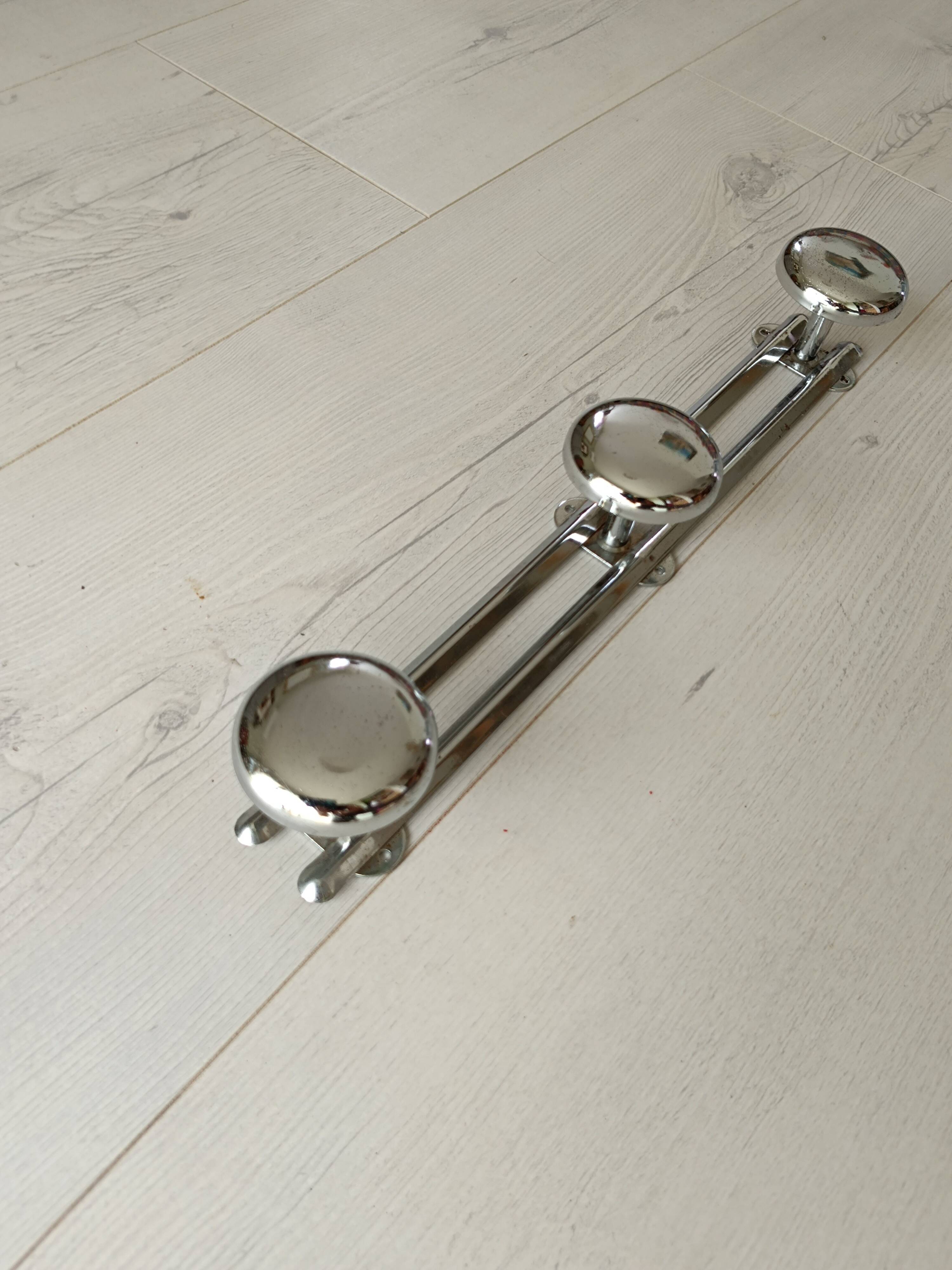 Chrome metal wall coat rack