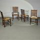 4 chaises à dossier échelle / 1 accoudoir / avec coussins en jonc