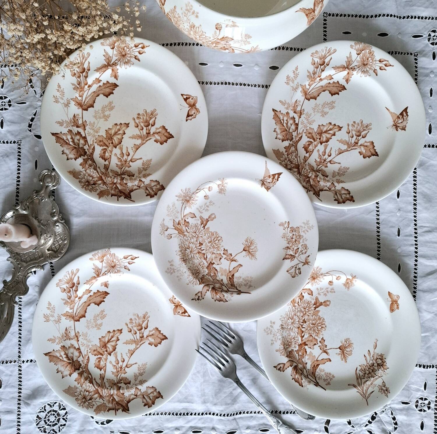 Antique iron earthenware plates accompanied by dishes