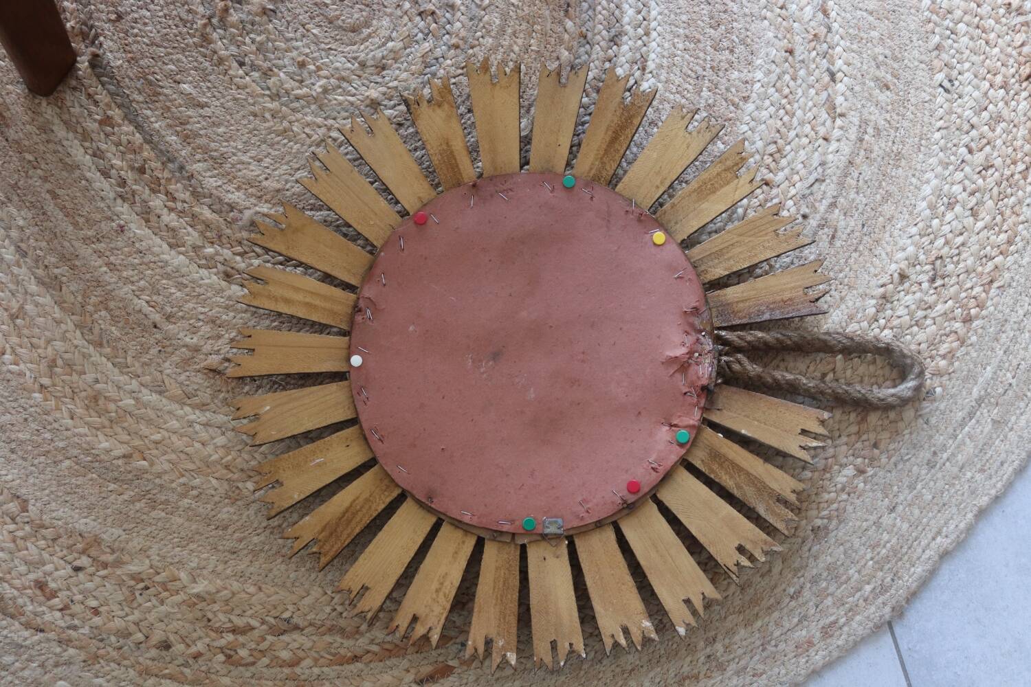 Old large sun mirror in gilded wood