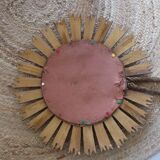 Old large sun mirror in gilded wood