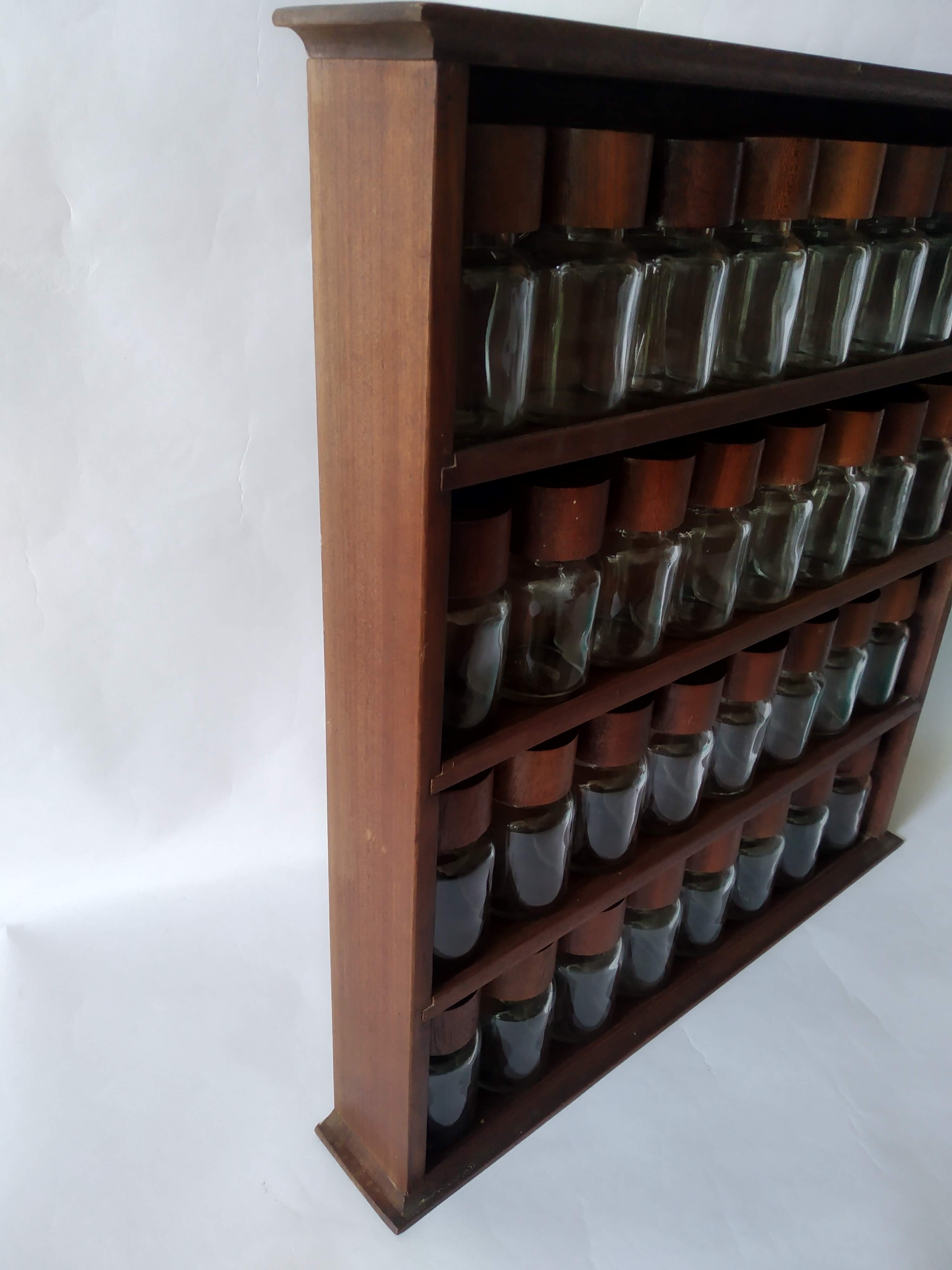 Wooden shelf with 32 vintage Cole & Mason spice jars