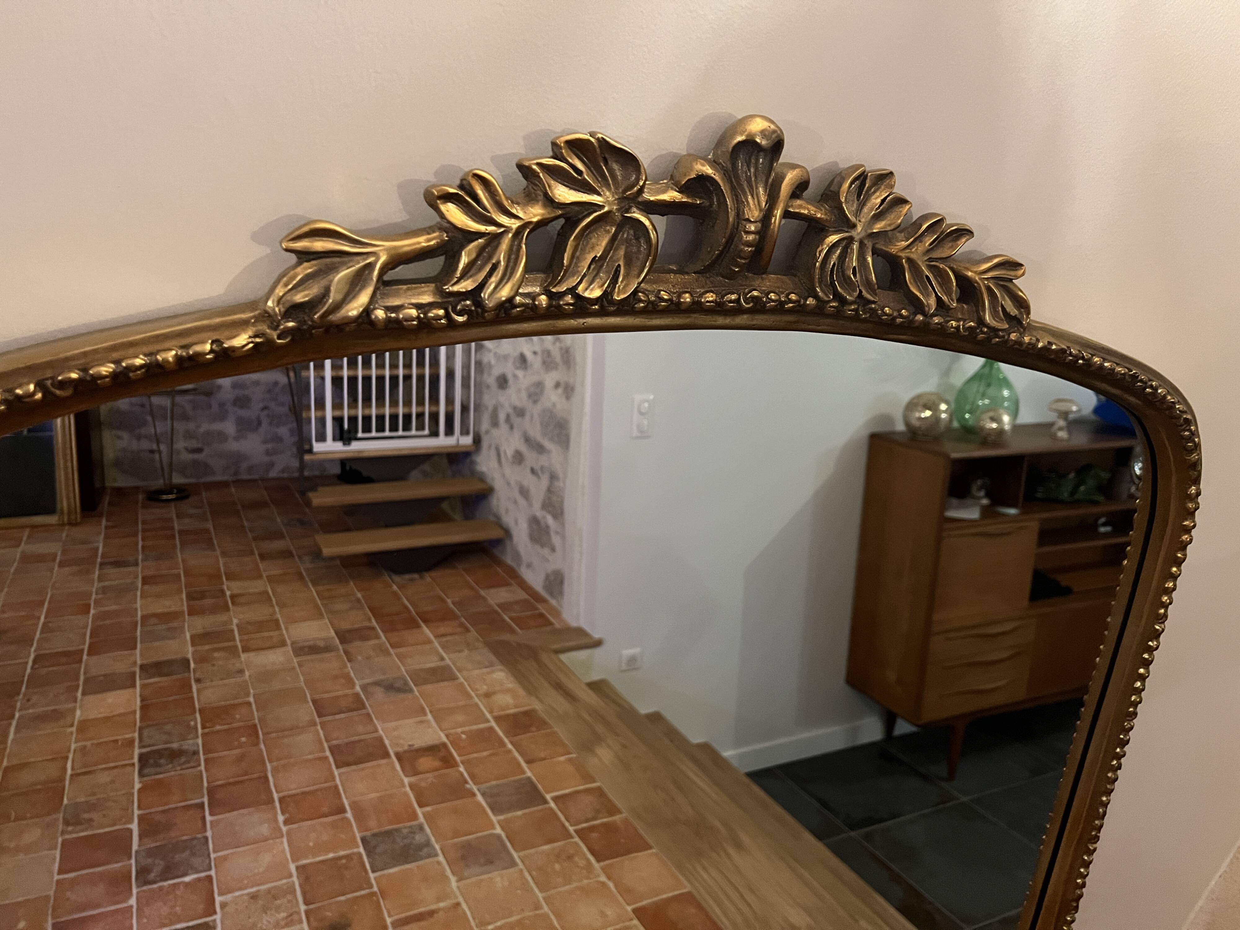 Large gilded mirror with pediment