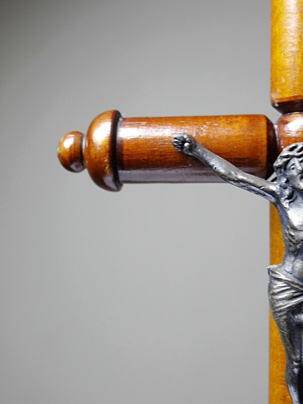 Antique wooden altar crucifix with a turned design and silver-plated Christ.