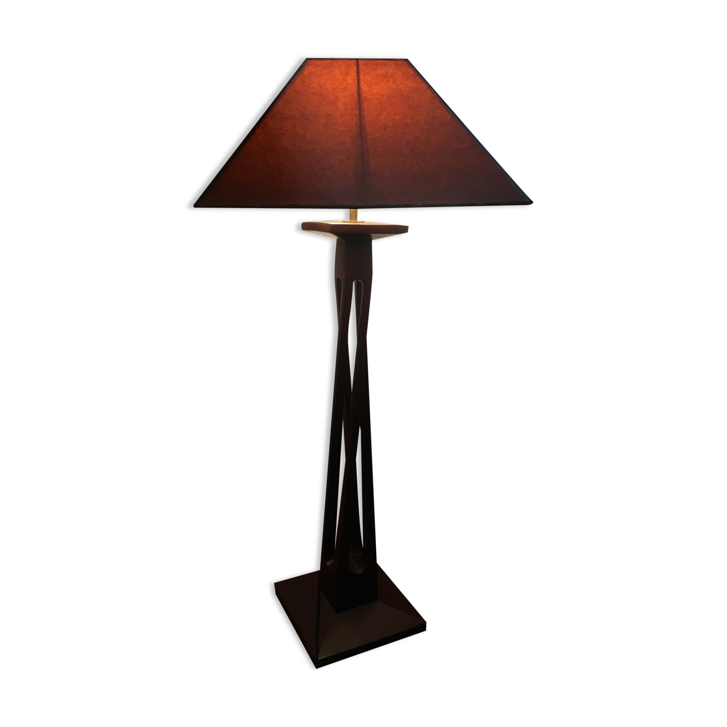 Mahogany lamp with a sculpted base.