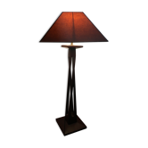 Mahogany lamp with a sculpted base.