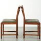 Ensemble de 4 chaises de salle à manger au design Art Déco avec un revêtement en tissu luxueux.