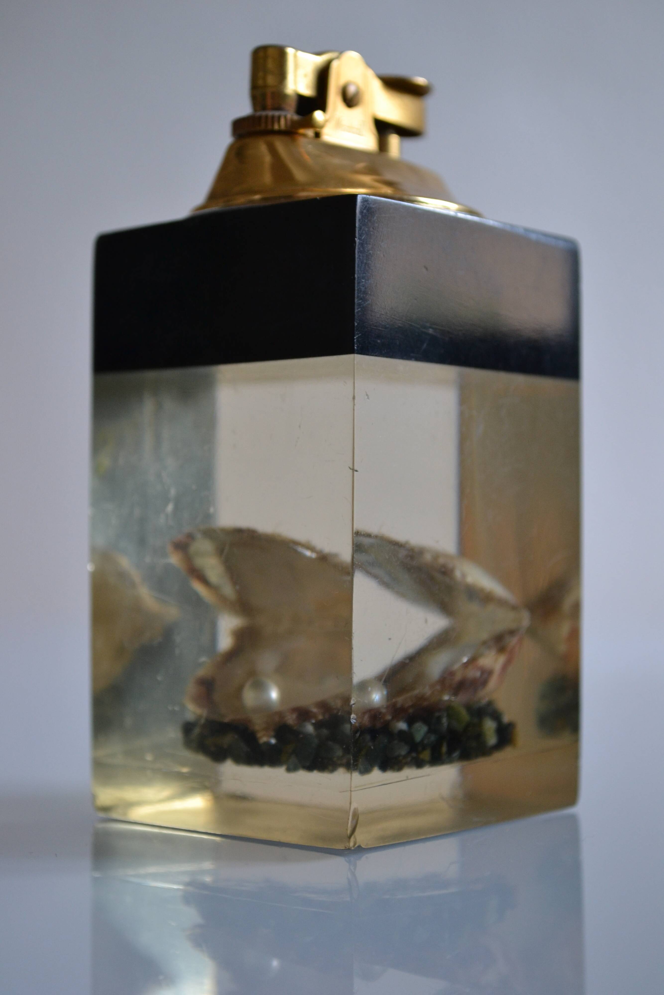 1970 Table lighter with pearl oyster in resin inclusion