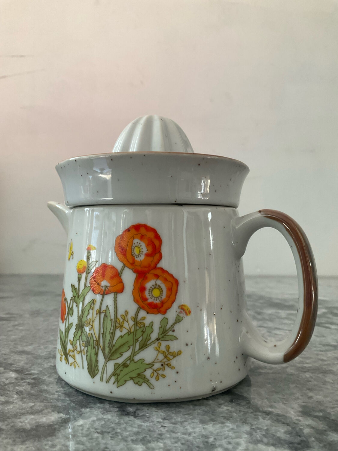 Vintage stoneware jug and its citrus juicer.