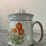 Vintage stoneware jug and its citrus juicer.